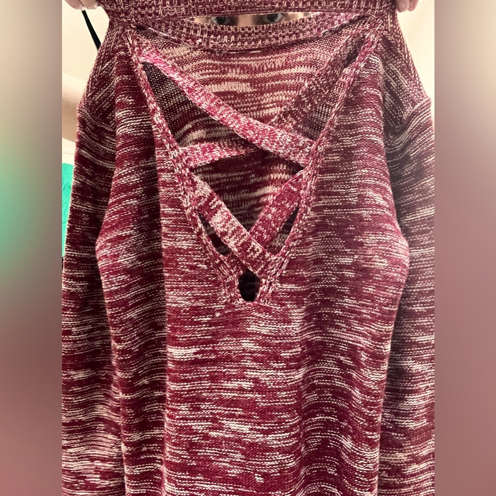 Small Knit Sweater with side slits and a unique back design